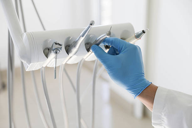 Professional Tooth Extraction technician working in Rogers, AR
